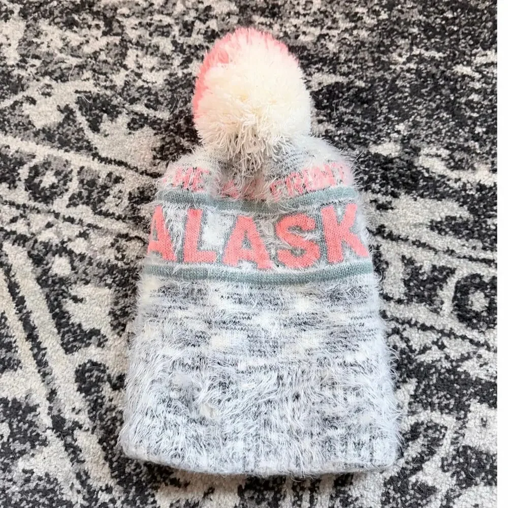 Robin Ruth Alaska heavy weight knit beanie hat with a variegated pink pom pom